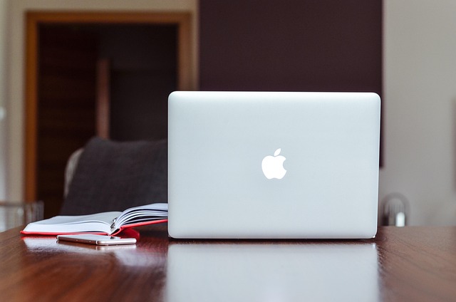 calm workspace with notebook and phone for contacting wellness education team